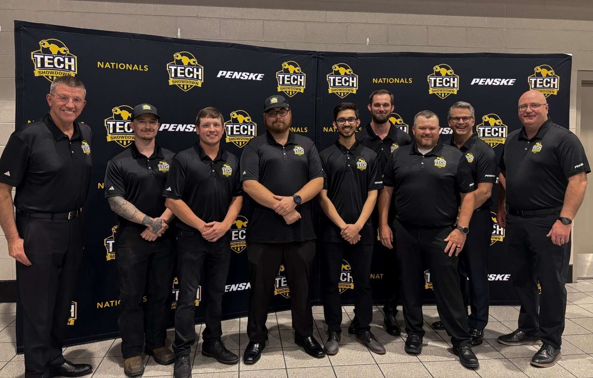 10 men standing in front of Tech Showdown backdrop
