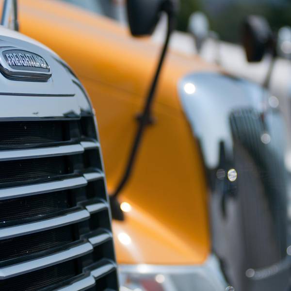 A close up image of semi trucks parked next to eachother.