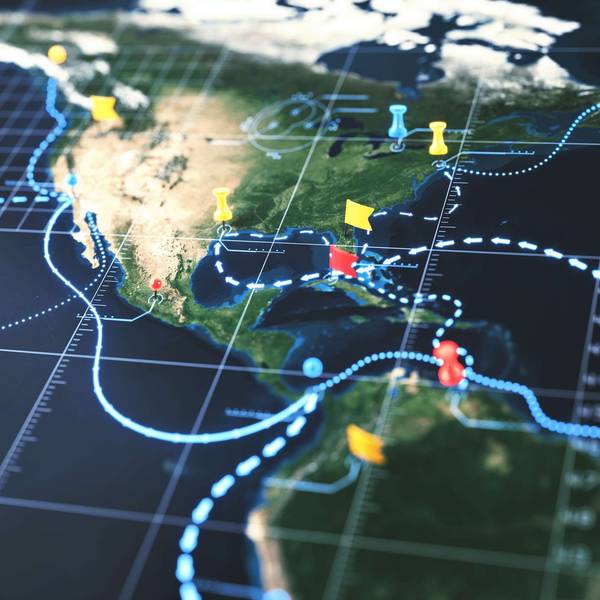 A closeup of a North American map with places pinned.