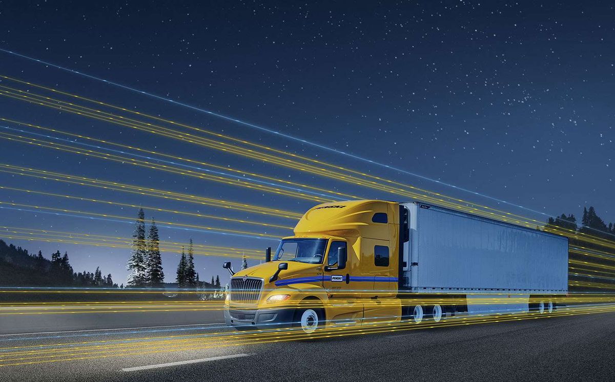 A digitally manipulated photo of a yellow and white Penske semi-truck at night.