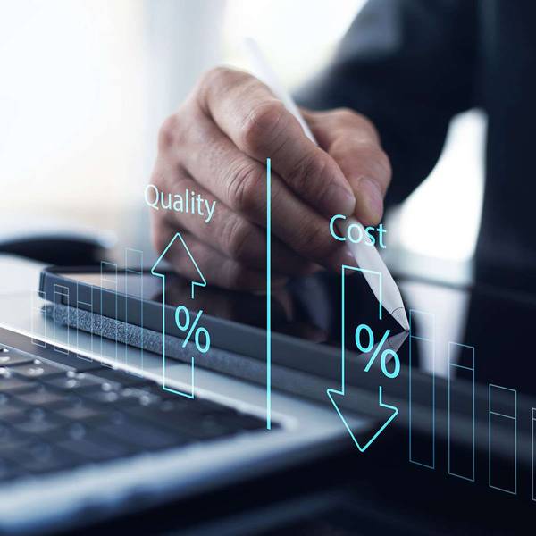 A graphic of quality increasing while cost decreases over a man in a suit writing on a tablet.