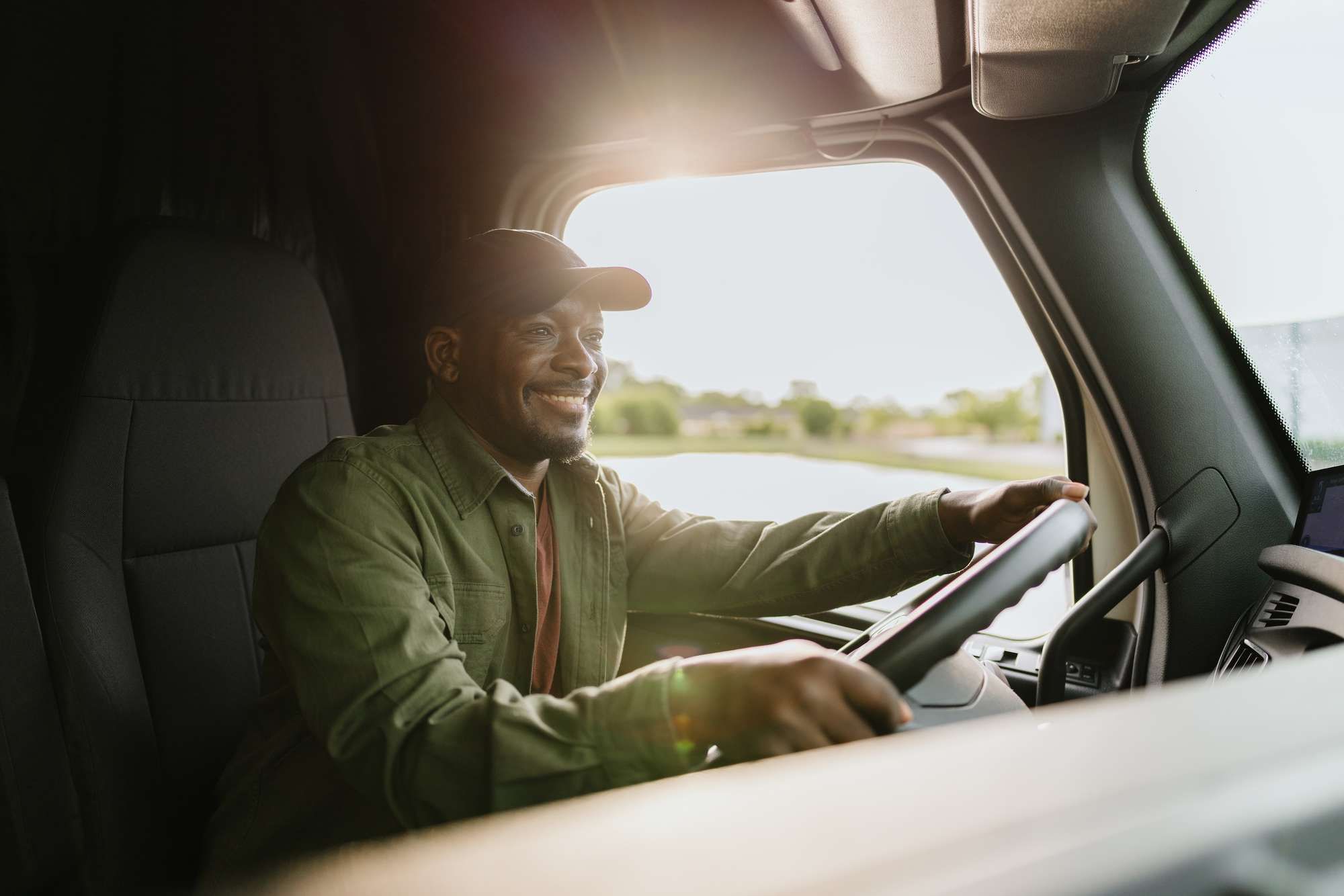 A man driving a semi-truck.