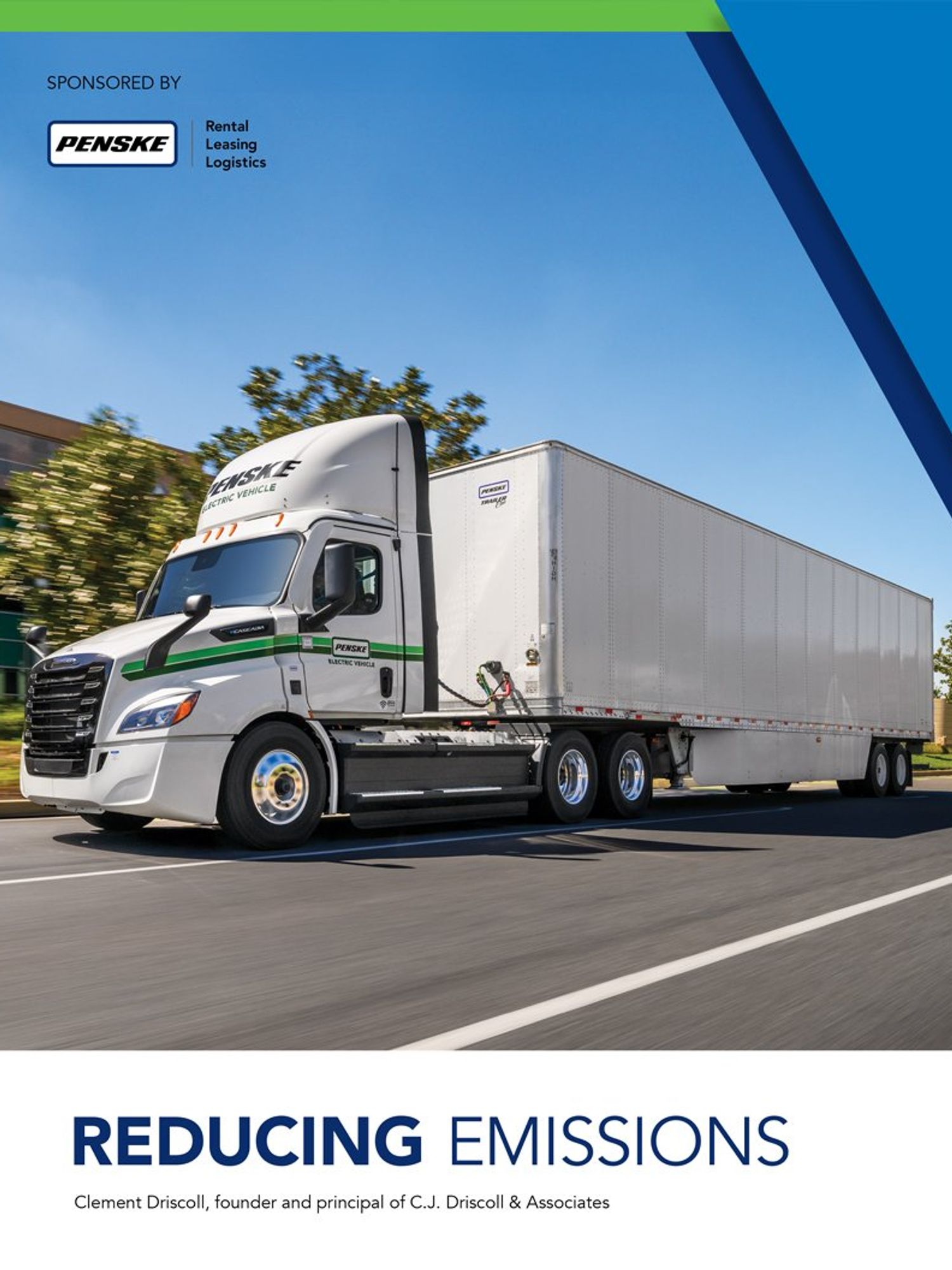 A white Penske semi truck driving down the road