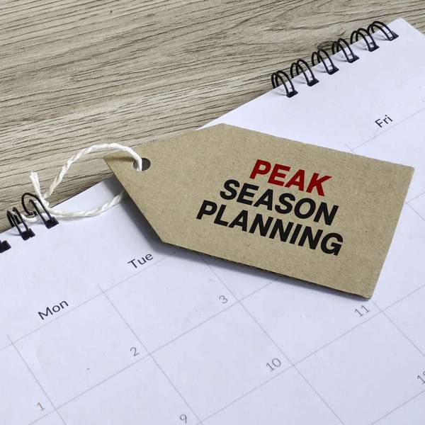 An empty calendar with a tag that reads "PEAK SEASON PLANNING"
