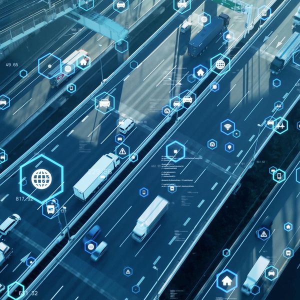 Blue graphic of semi-trucks driving on freeways