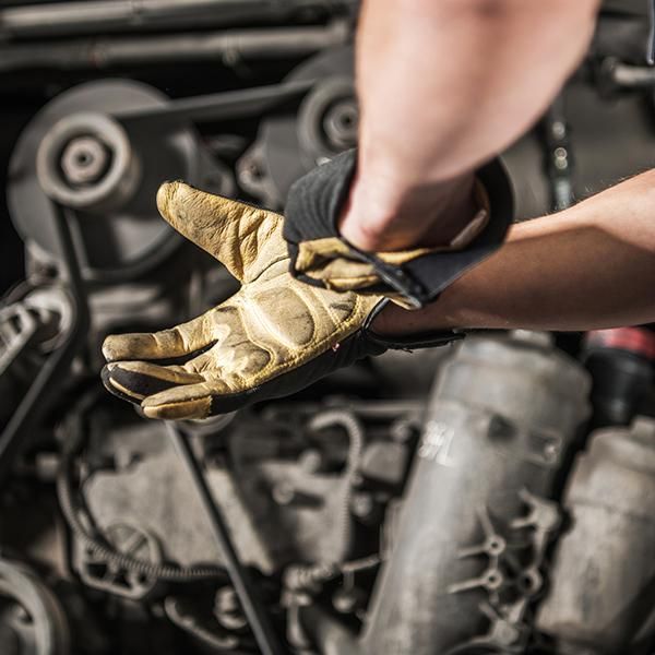 Diesel technician prepares to work.