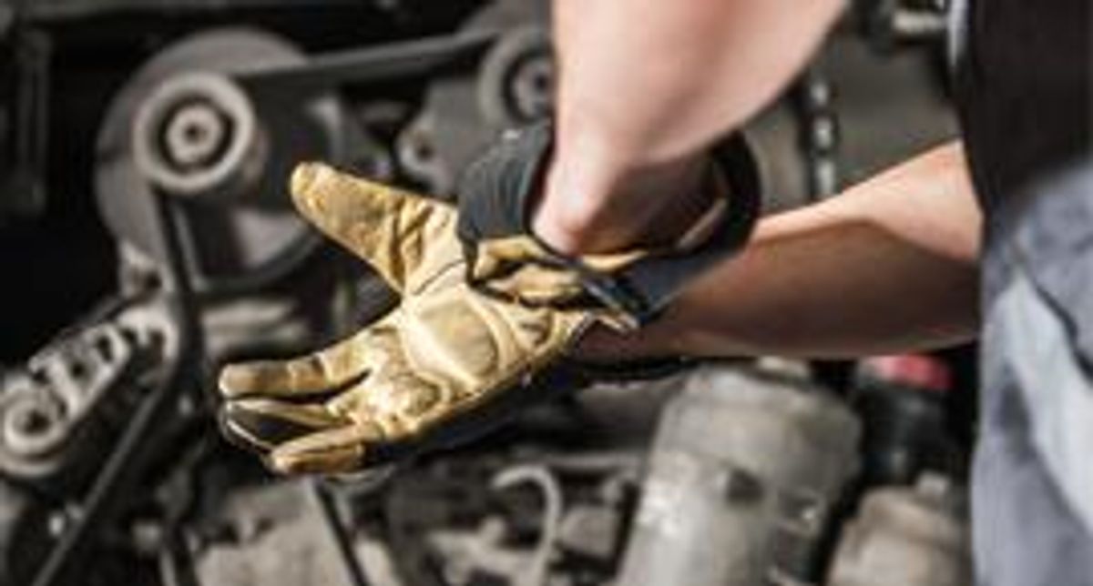 Diesel technician prepares to work.