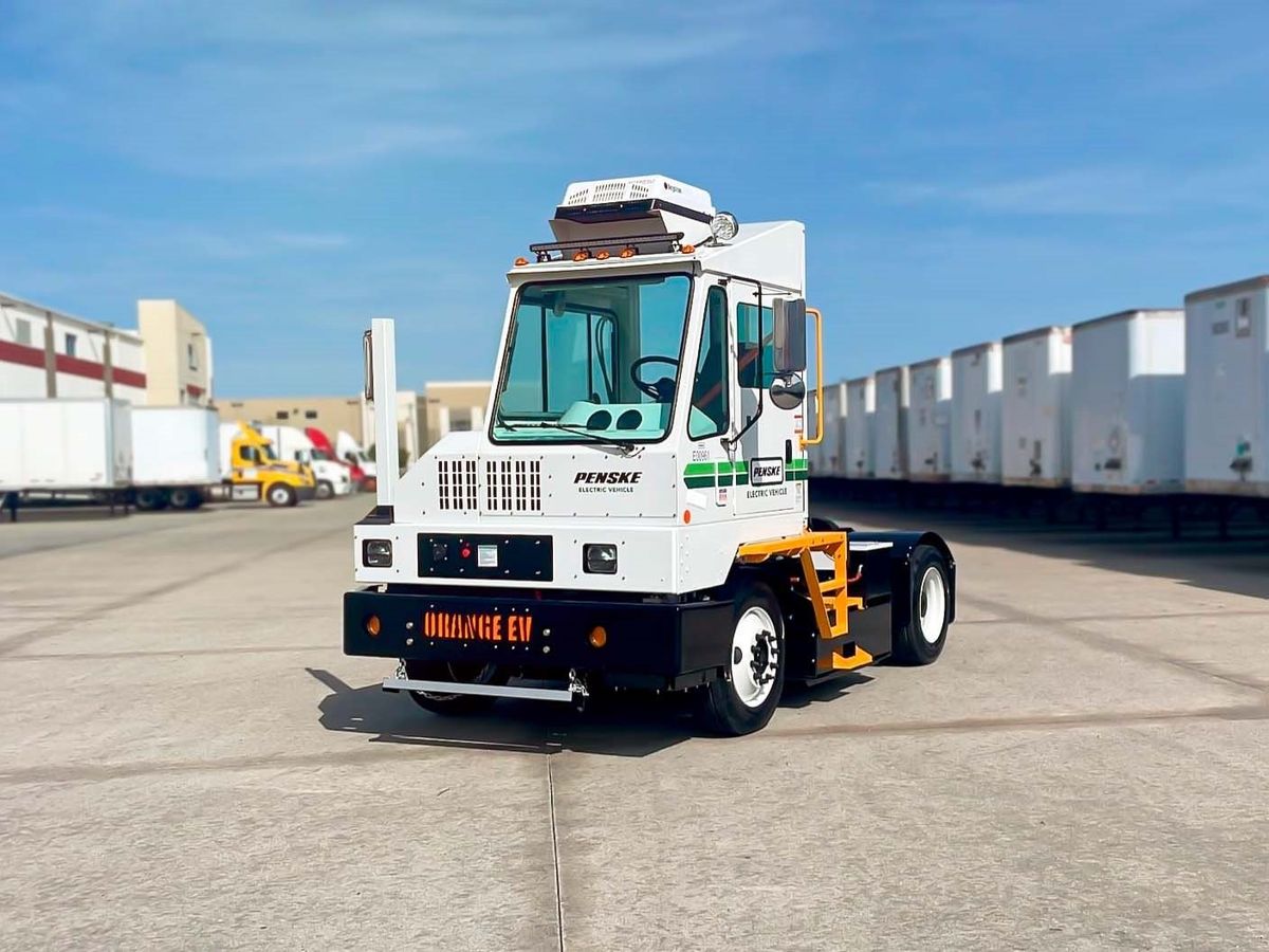 Electric yard truck parked at a distribution center.