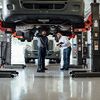 Maintenance Employees Checking Truck