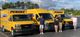 military family saluting in front of penske trucks