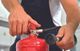 truck driver with fire extinguisher