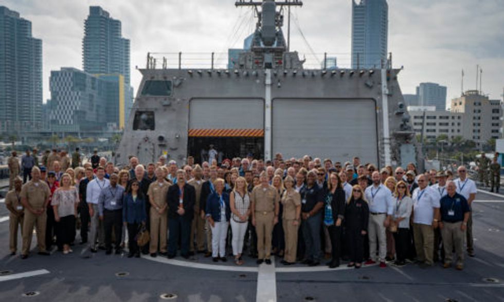 Group photo of U.S. Navy Reserves and Penske employees.