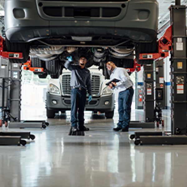 Maintenance Employees Checking Truck