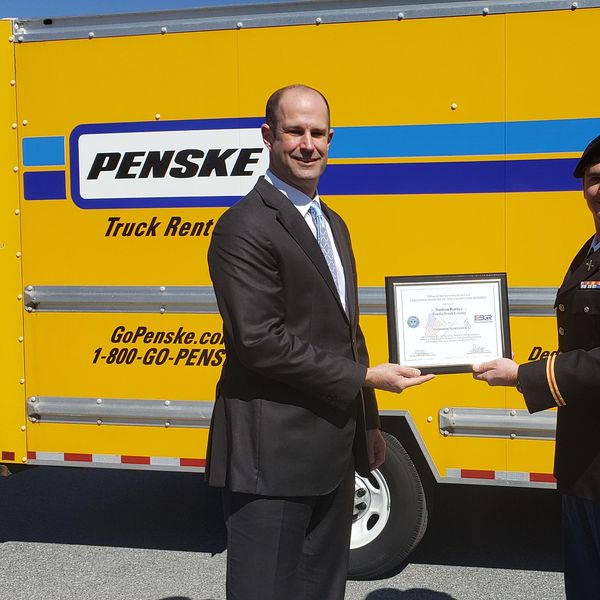 patriot award given in front of penske truck