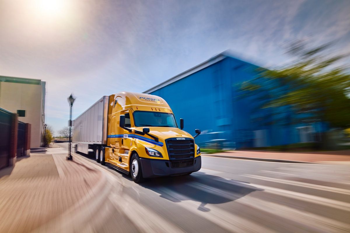 Penske rental tractor driving down street