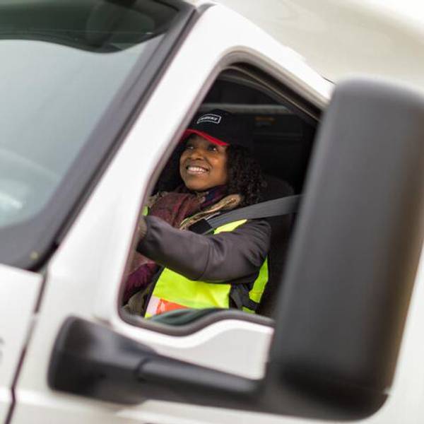professional truck driver wearing a seat belt