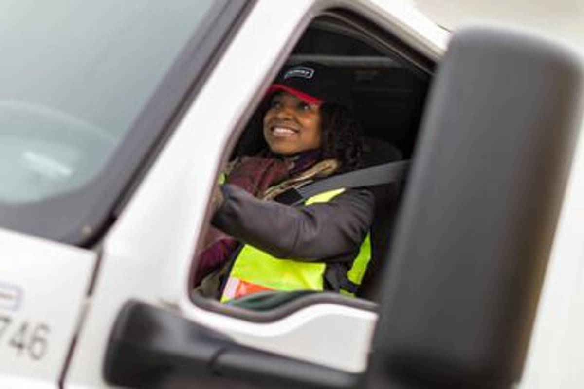 professional truck driver wearing a seat belt