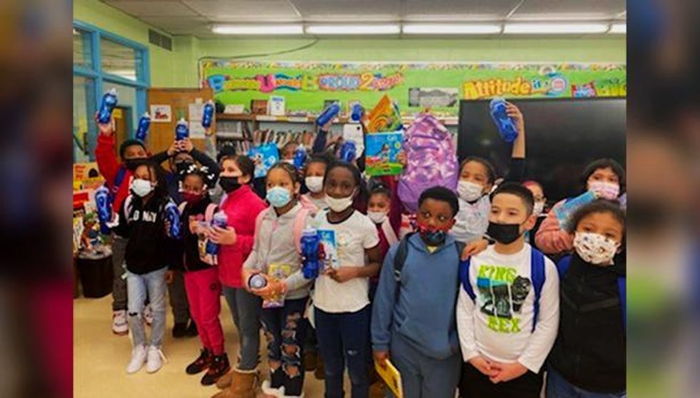 Students at Martin Luther King, Jr. Academy in Yonkers, NY pose after receiving school supplies from Penske Truck Leasing associates.