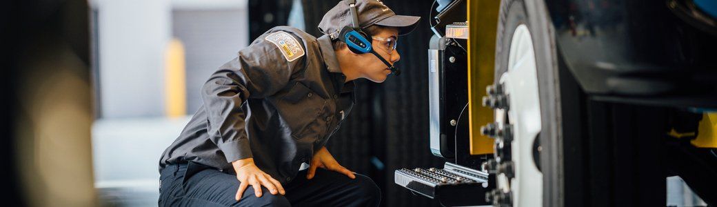 Technician servicing truck