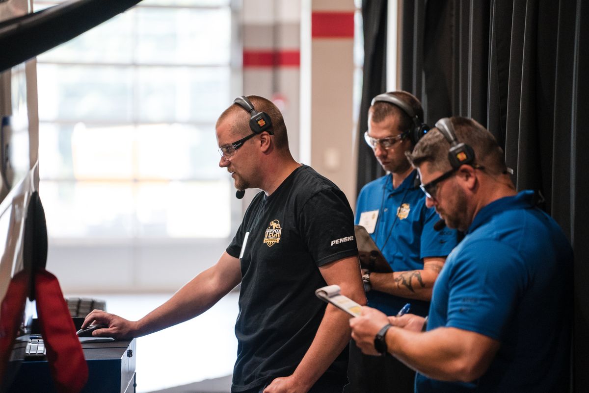 Technicians participating in a hands-on skills challenge