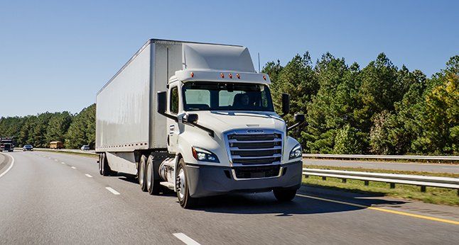 Three Penske trucks