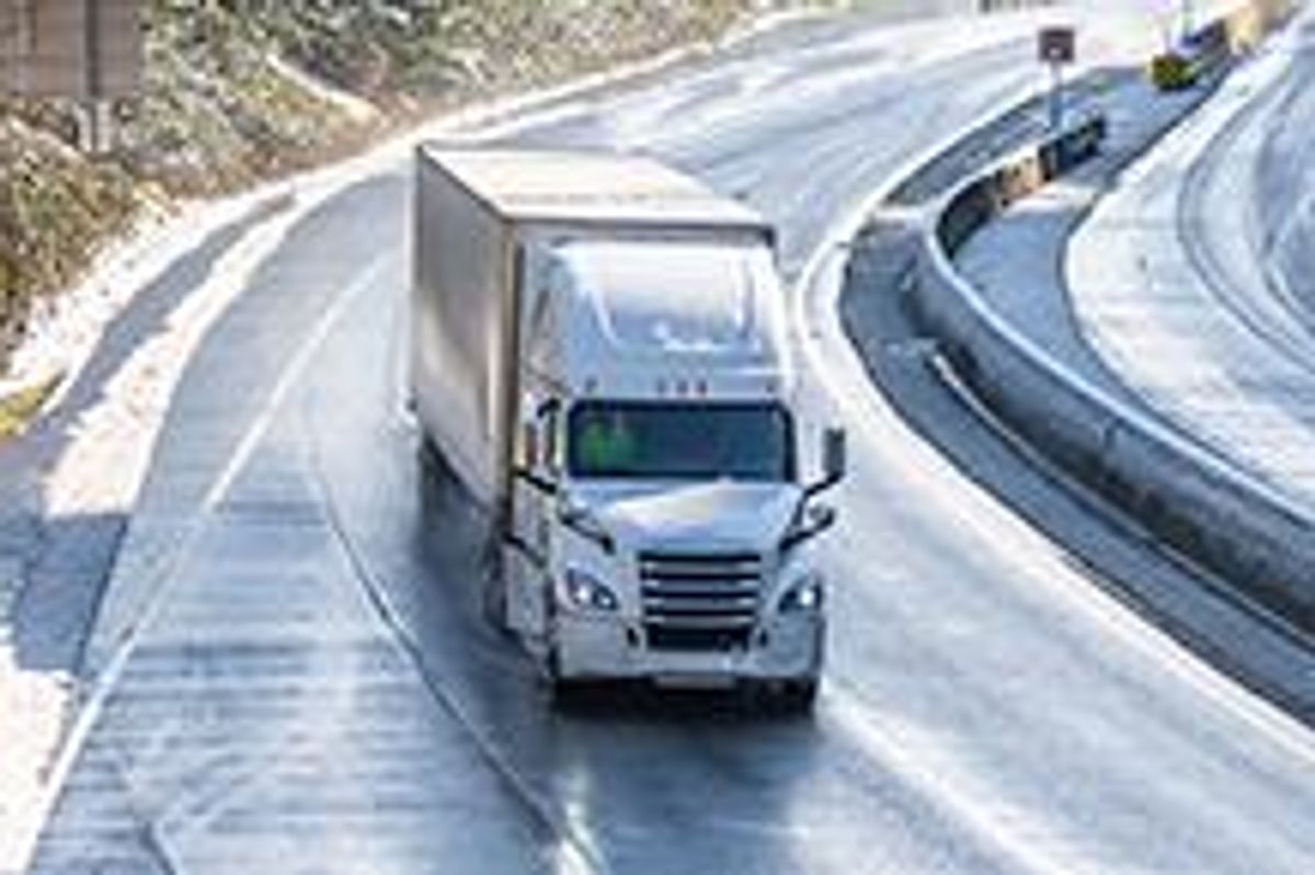 Truck driving in winter landscape