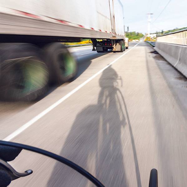 truck driving on hot road in the summer