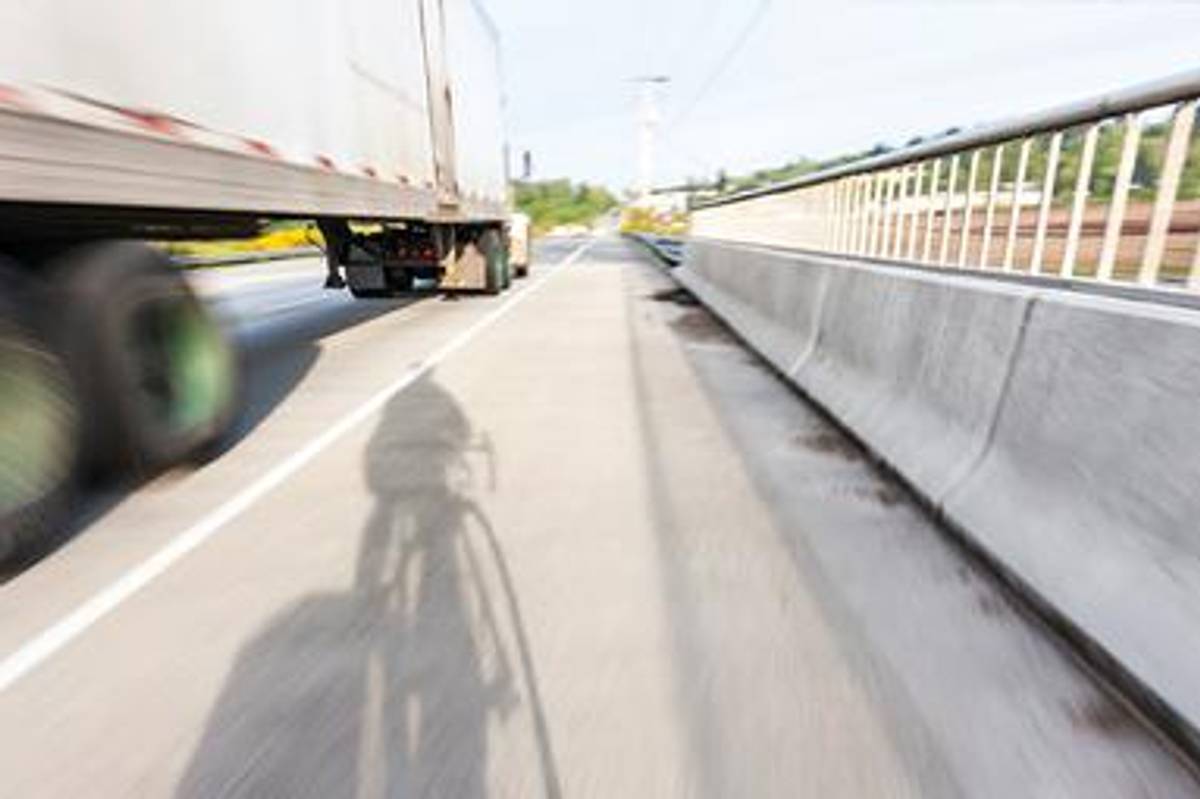 truck driving on hot road in the summer