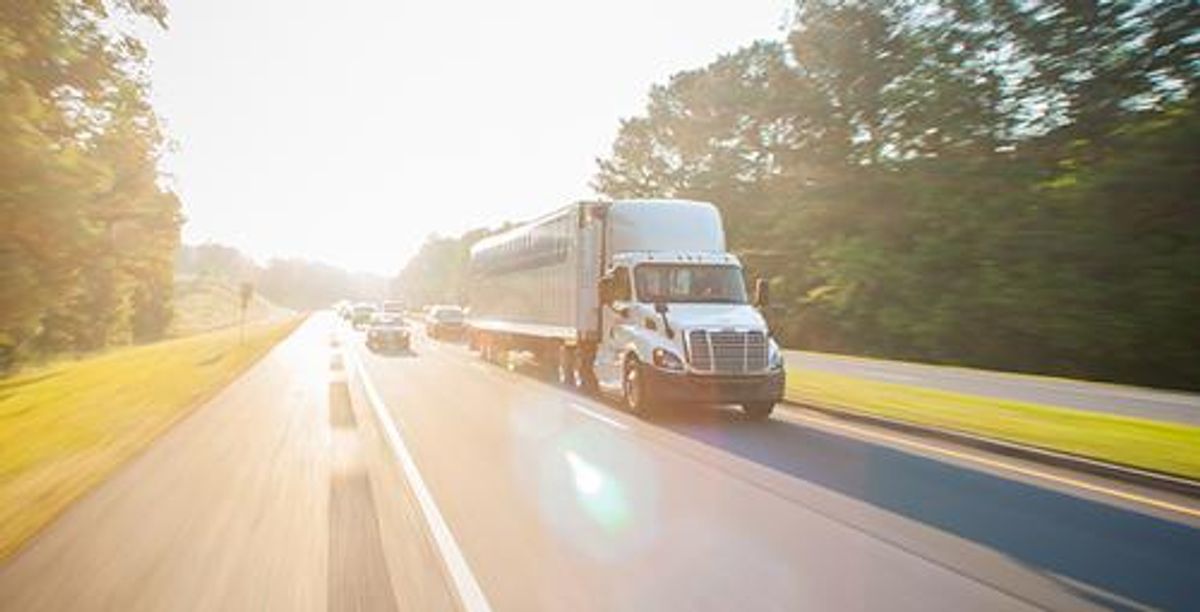 Truck on the highway in the heat