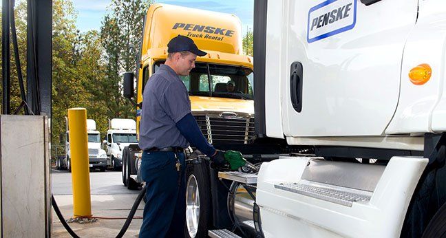 Trucker fueling up truck