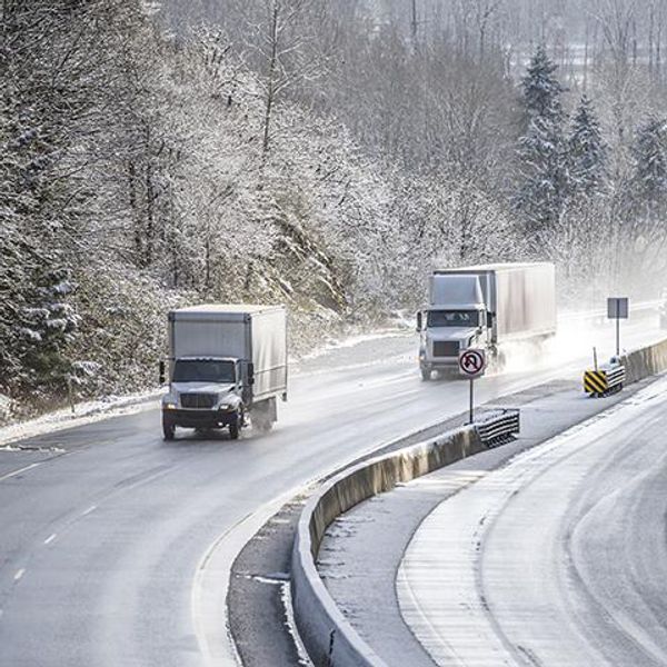 trucks driving on winter roads