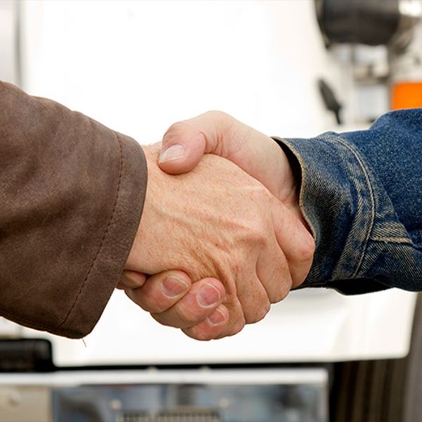 Two people shaking hands.