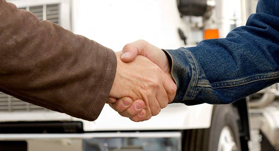 Two people shaking hands.