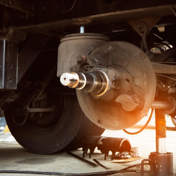 Wheel well and brake pads on a truck ready for maintenance